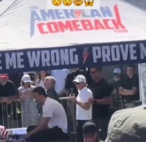 PHOTO Two Guys Behind Charlie Kirk Are Up To No Good Making Hand Gestures While He's Speaking