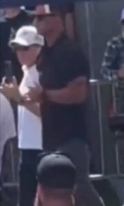 PHOTO Two Men Behind Charlie Kirk Were Actually Giving Baseball Hand At The Same Time