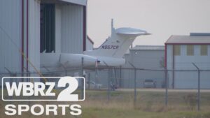 PHOTO Plane Half Pulled Into A Hanger So Nobody Can See Who Is Boarding Plane Carrying Lane Kiffin And His Family