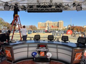 PHOTO College Gameday Desk Setup In Green Space Outside Jones AT&T Stadium