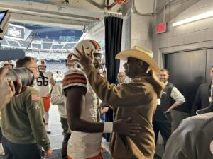 PHOTO Deion Sanders Holding His Son By The Helmet After Big Win In Vegas