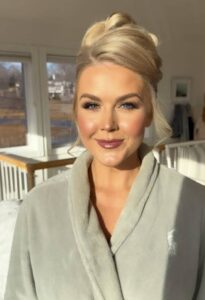 PHOTO Karoline Leavitt Wearing Lip Stick While In A Bath Robe