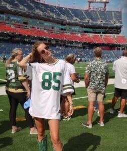 PHOTO Tucker Kraft's Wife On The Field In Nashville Wearing A Green Bay Packers Jersey And Nothing Else