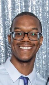 PHOTO Brian Cole Wearing Dress Shirt And Tie And Glasses