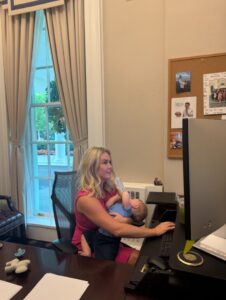 PHOTO Karoline Leavitt Looking Smoking Hot Working On The Computer While Feeding Her Son