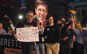 PHOTO Mayor Of Providence Brett Smiley And His Husband Holding Up A Sign