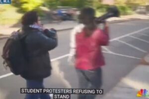 PHOTO Mustapha Kharbouch Caught On NBC News Protesting In The Streets