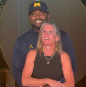 PHOTO Sherrone Moore Holding More Than One Blondie At A Time