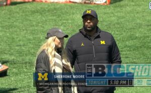 PHOTO Sherrone Moore Standing In The Grass With Paige Shivers At Michigan Spring Practice