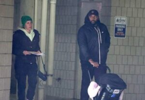 PHOTO Sherrone Moore Wheeling Around His Newborn With His Wife Kelli After Affair Became Public