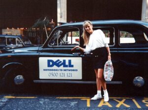 PHOTO Susan Dell Actually Looking Hot Before 2000 In Front Of DELL Support Vehicle