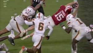 PHOTO Fernando Mendoza Scoring A TD With 3 Defenders Trying To Tackle Him And Missing