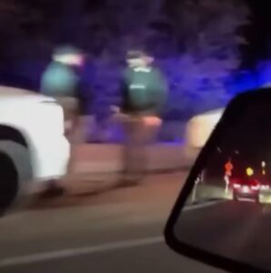 PHOTO Still Shot Of Carlos Alberto Palazuelos Jr Being Detained By Police On The Side Of The Road