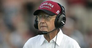 PHOTO Lou Holtz Wearing A South Carolina Football Hat While Coaching