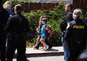PHOTO Kids Walking Home From School Surrounded By Police After San Diego Mass Shooting At Mosque